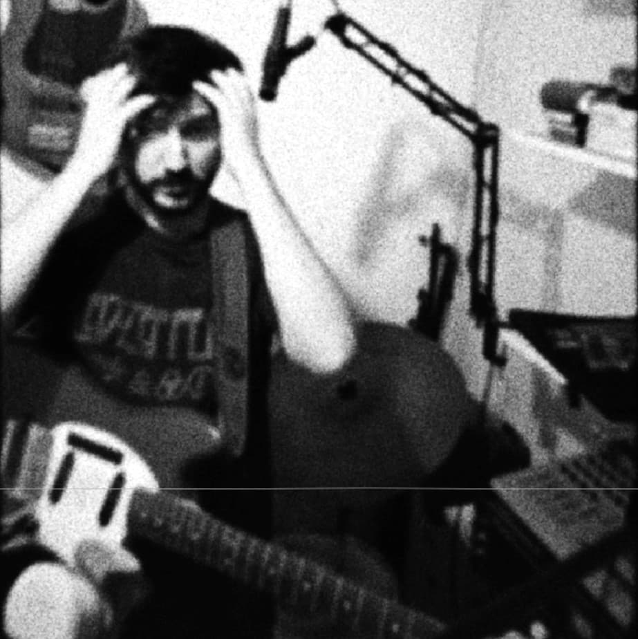 guitarist grabbing his head